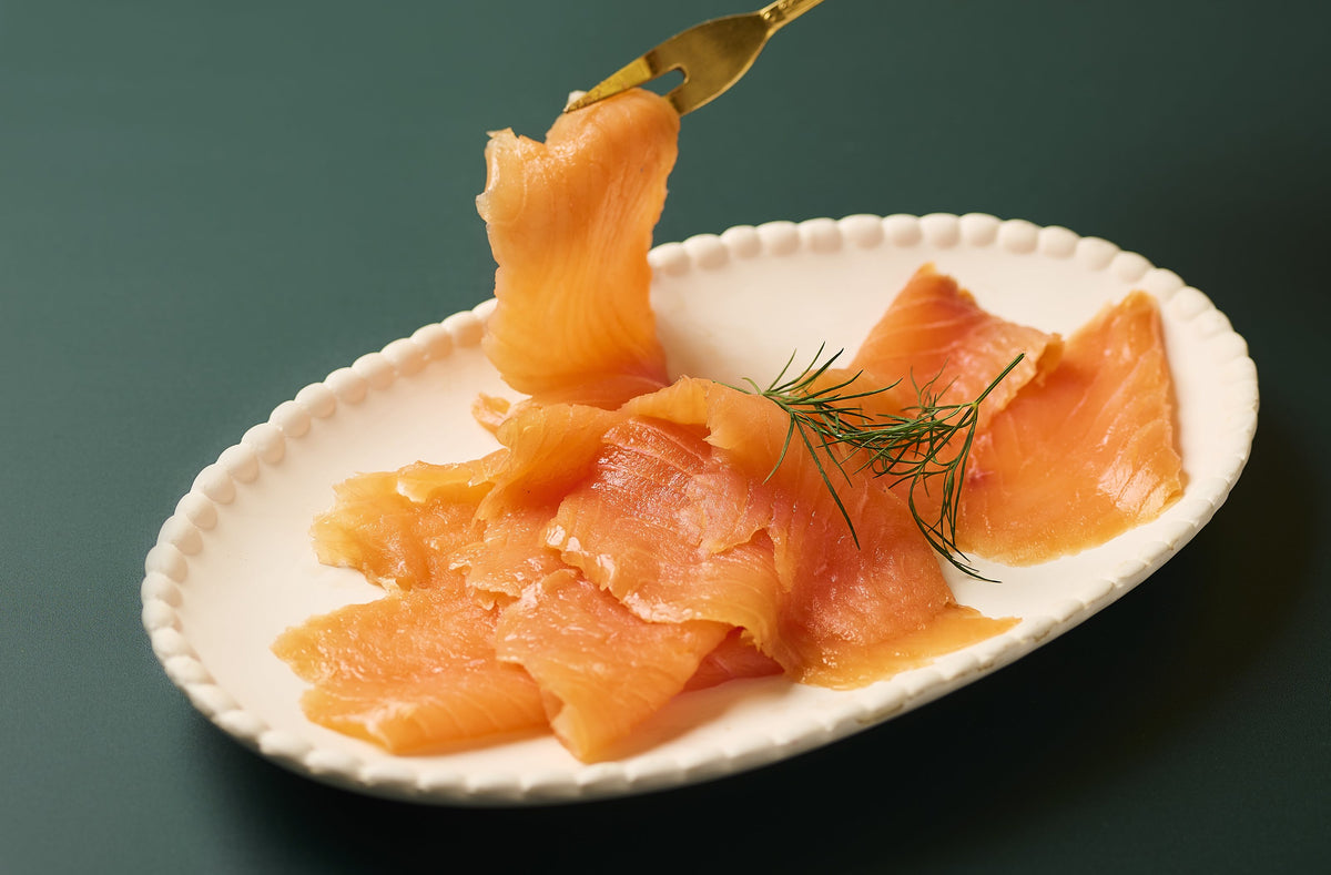Caviar House smoked salmon slices on a plate